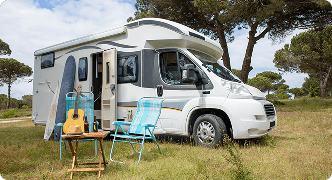 Recreational vehicle parked outdoors representing RV insurance coverage for travel and camping