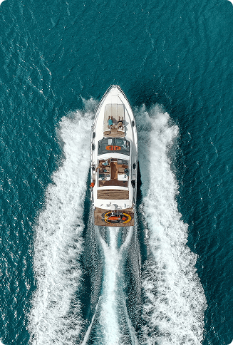 Aerial view of luxury motorboat cruising through open blue water